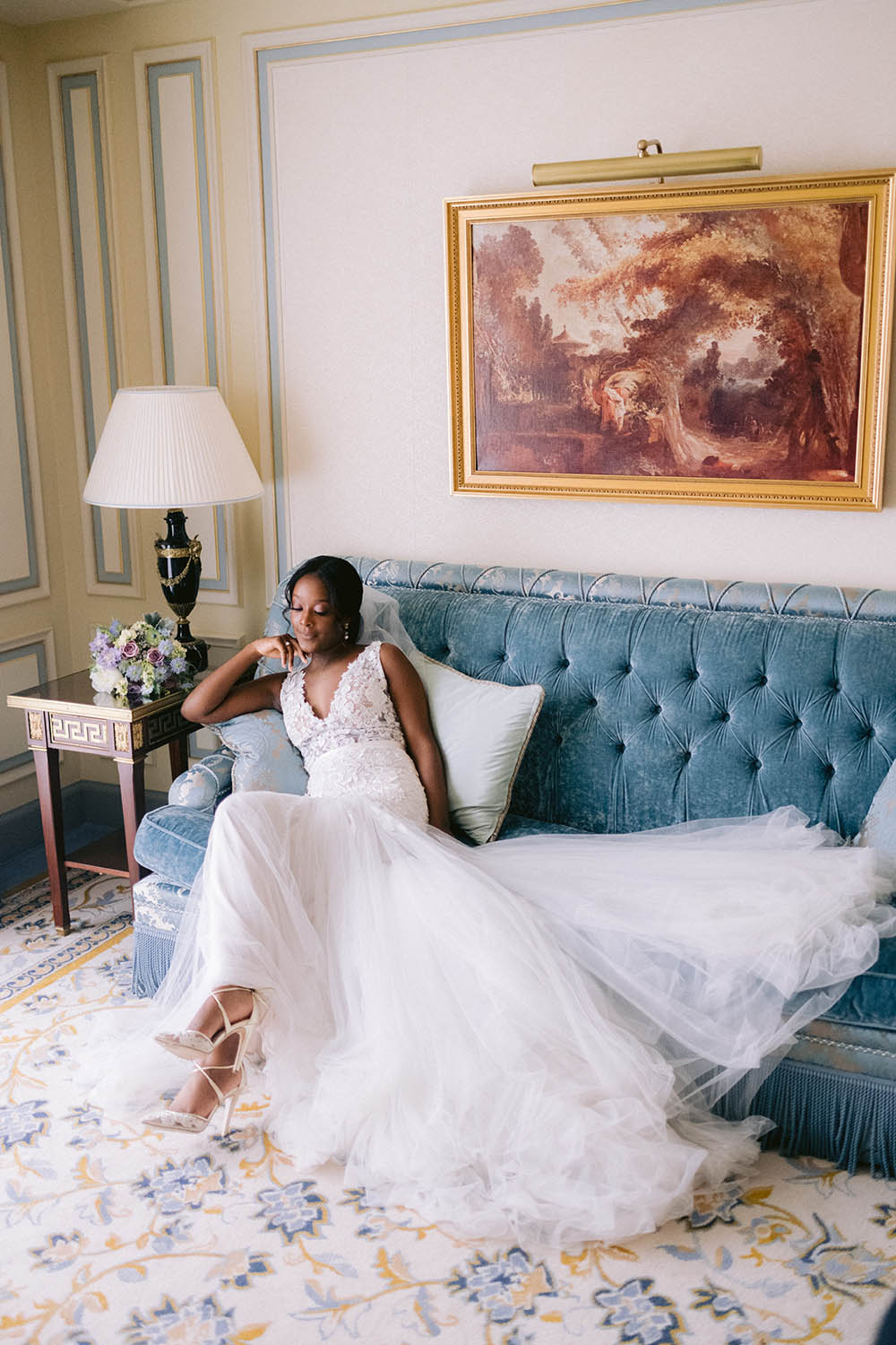 bride site down on the sofa in the roon of the ritz paris